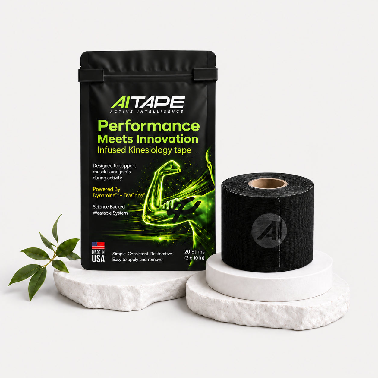 AITAPE Performance Infused Kinesiology Tape black packaging and a matching black tape roll with logo on a white display stand.