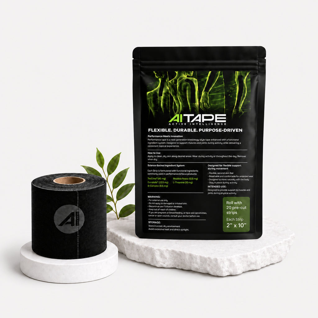Back view of black AITAPE Active Intelligence Kinesiology Tape packaging showing instructions, warnings, and drug facts next to a black tape roll.