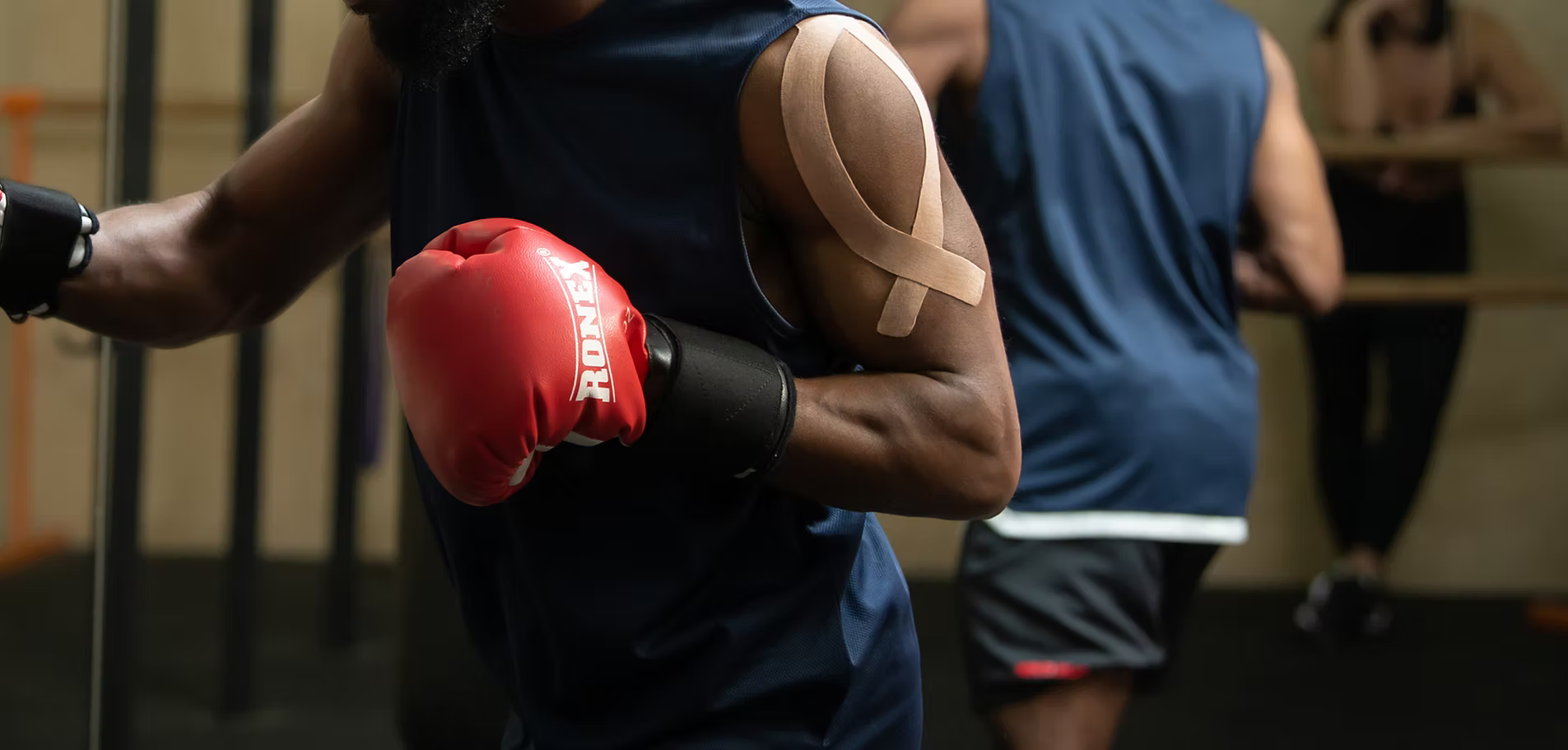 Header banner for Active Intelligence taping instructions page featuring a boxer.